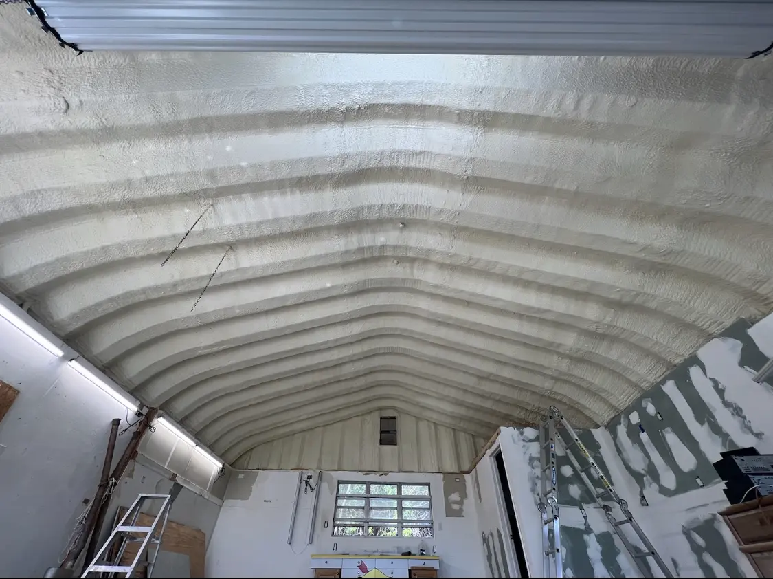 Spray polyurethane foam applied to the underside of a metal roof deck in Oak Ridge